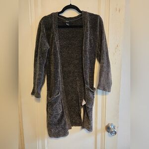 grey soft fuzzy women's cardigan with pockets and 3/4 length sleeves and 2 slits